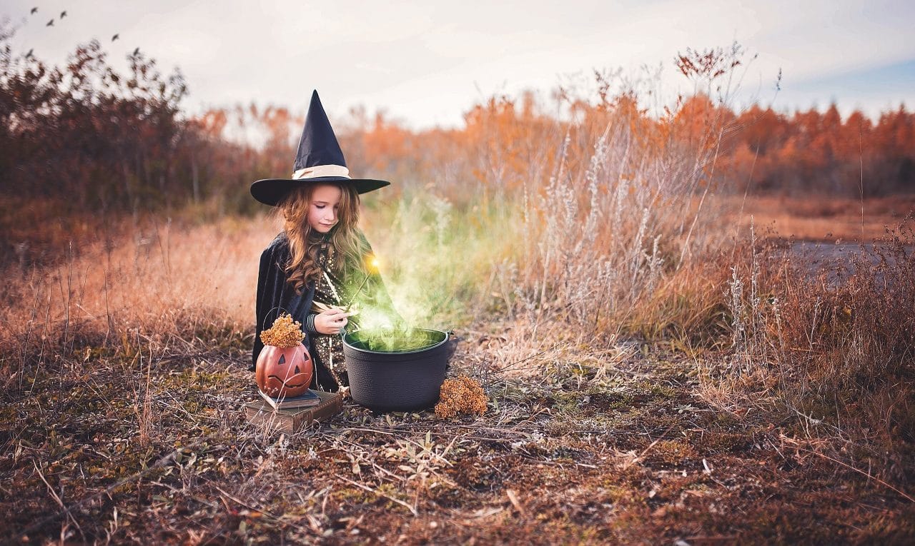 Child dressed for Halloween outdoors